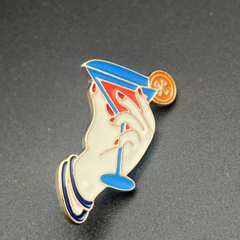 Hand Holding Martini Glass Orange‎ Slice Lapel Hat Pin